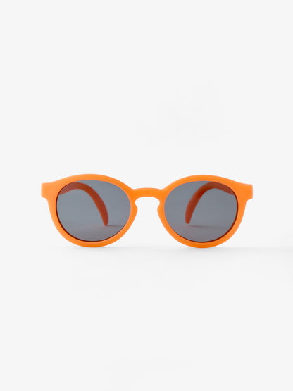 Round pair of baby sunglasses in orange showing the front view