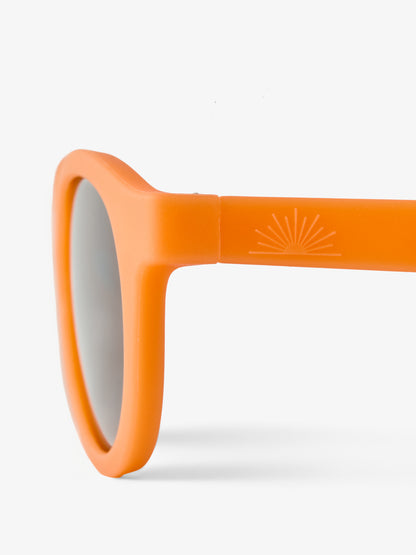 Close up of round baby sunglasses showing Petit Peepers half sun logo on the side 