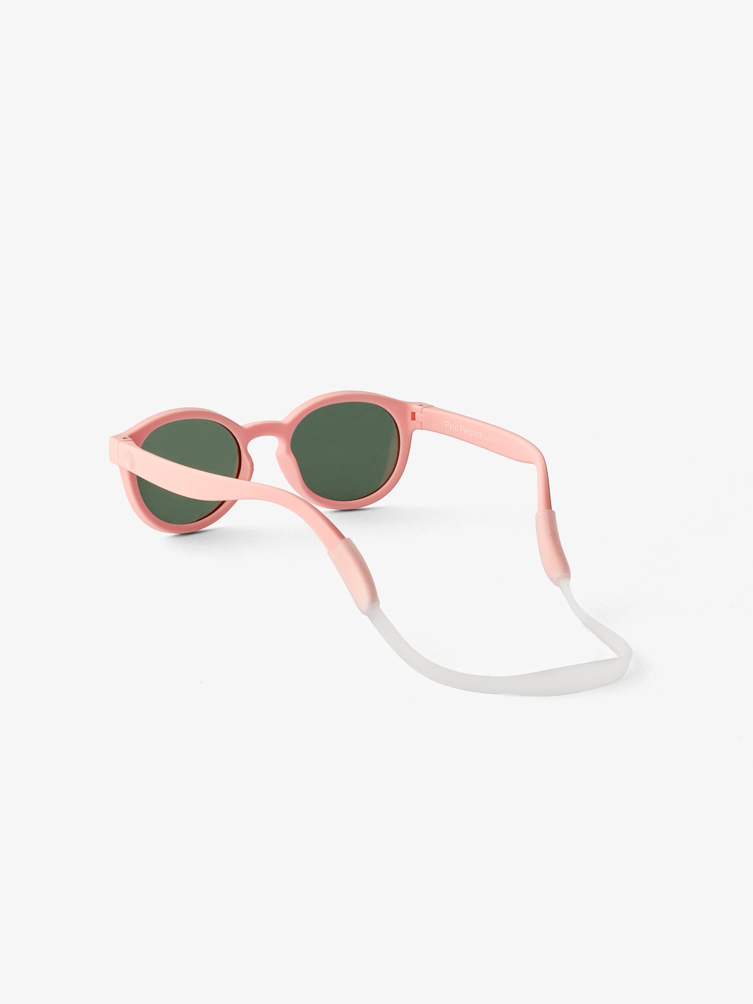 Round pink baby sunglasses with silicone strap shown from the back