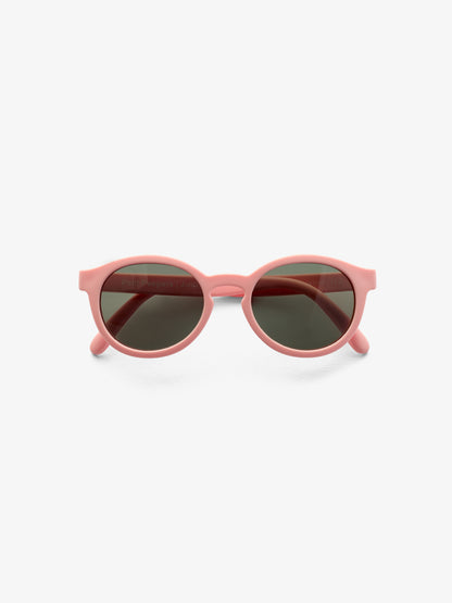 Folded pair of pink round baby sunglasses