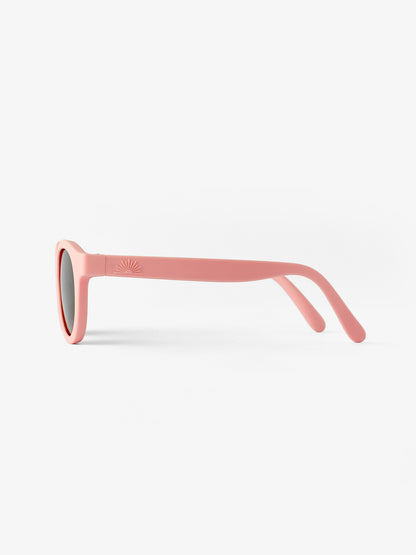Side view of a pair of pink baby sunglasses
